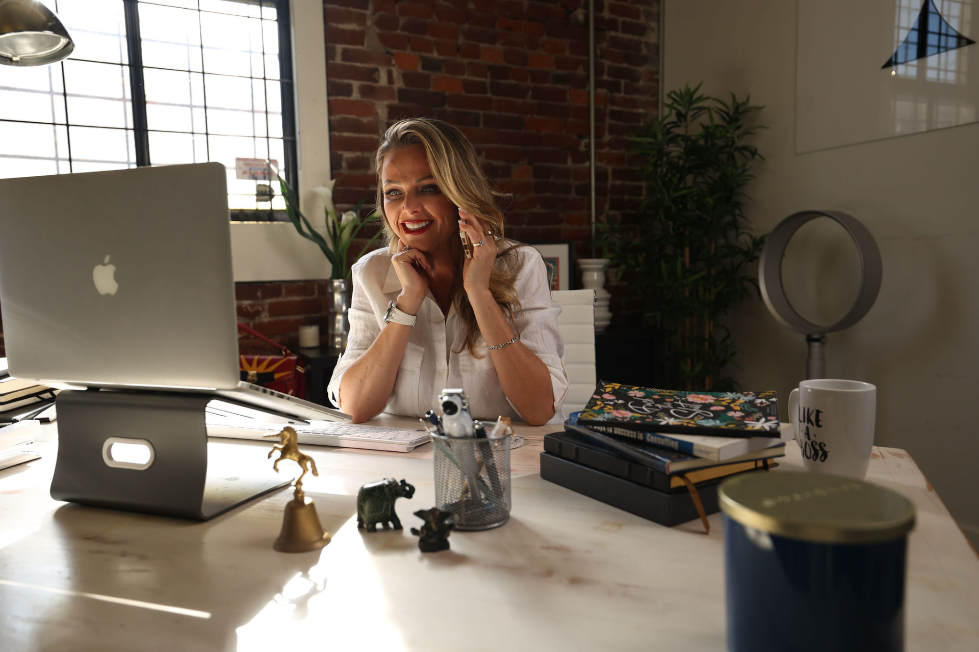 Crystal Carson on a call at her desk during a working session.